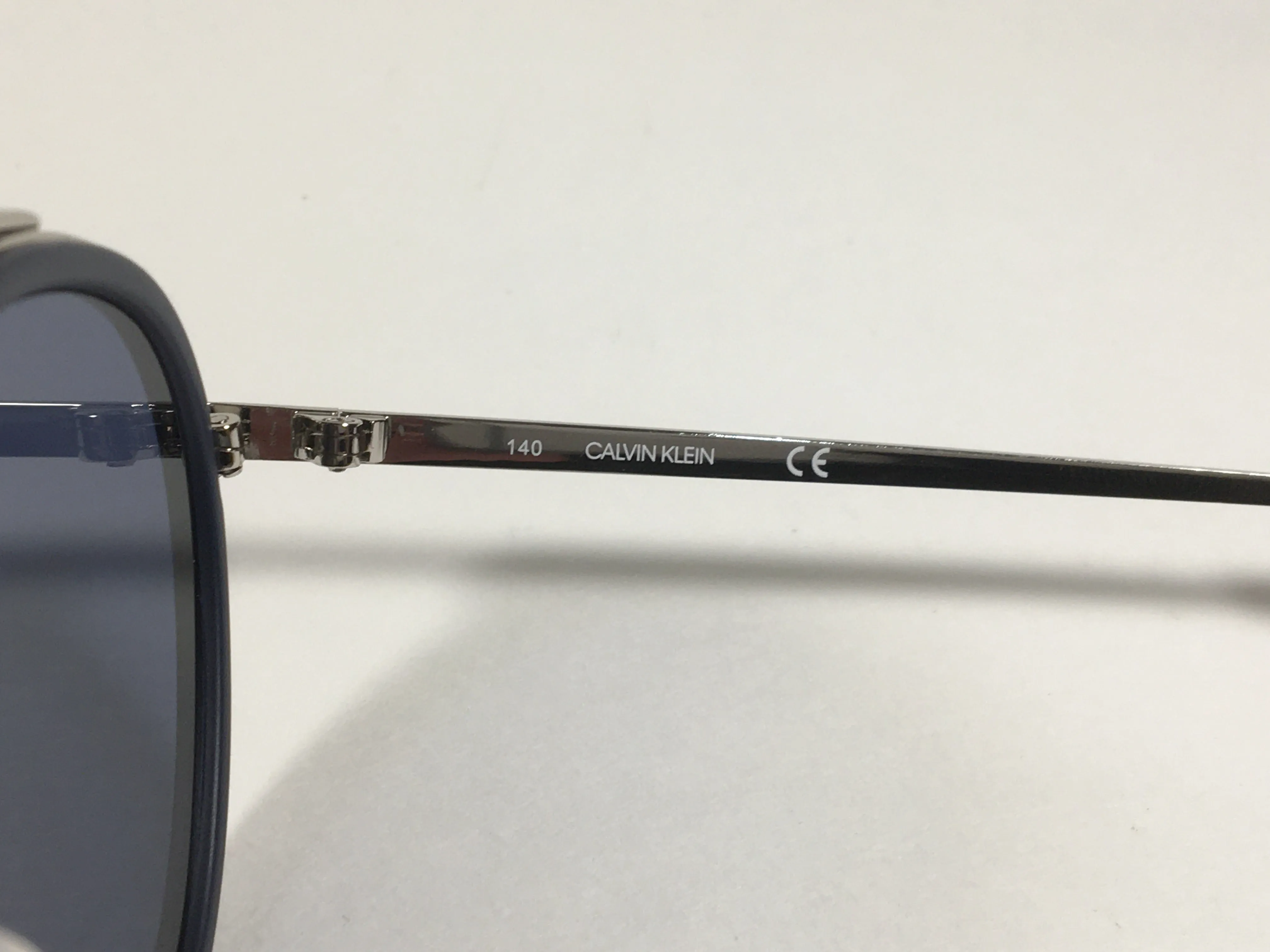 Calvin Klein CK19131S 410 Round Sunglasses Navy Blue And Silver Frame Gray Lens