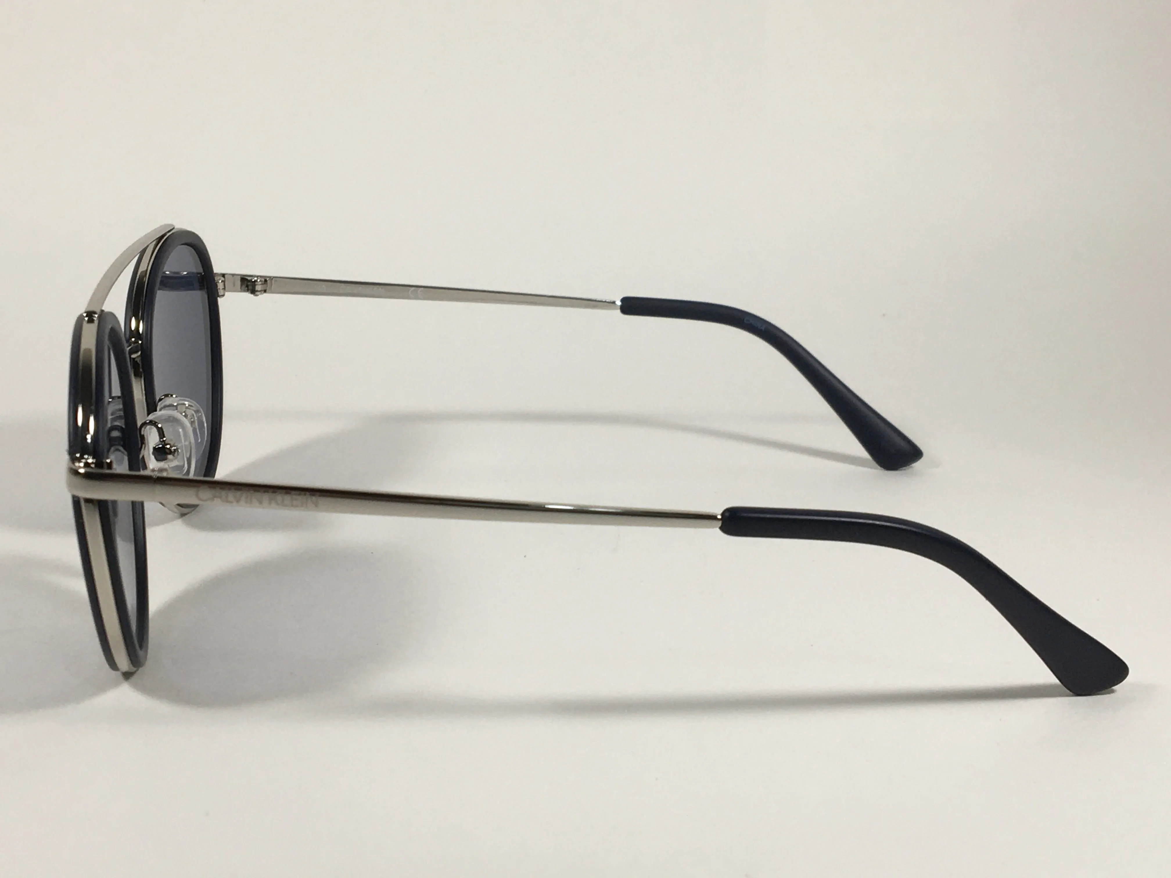 Calvin Klein CK19131S 410 Round Sunglasses Navy Blue And Silver Frame Gray Lens