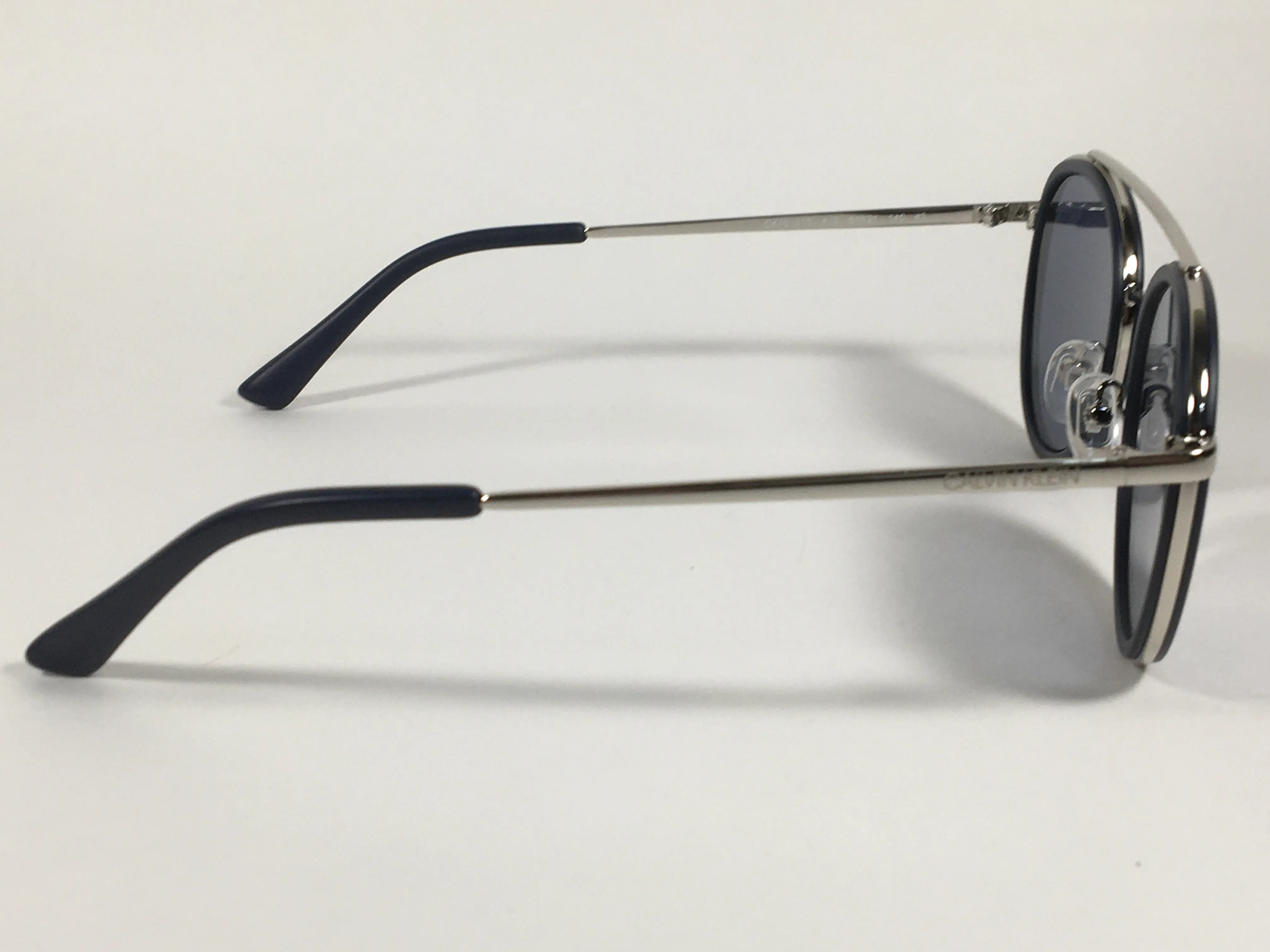 Calvin Klein CK19131S 410 Round Sunglasses Navy Blue And Silver Frame Gray Lens
