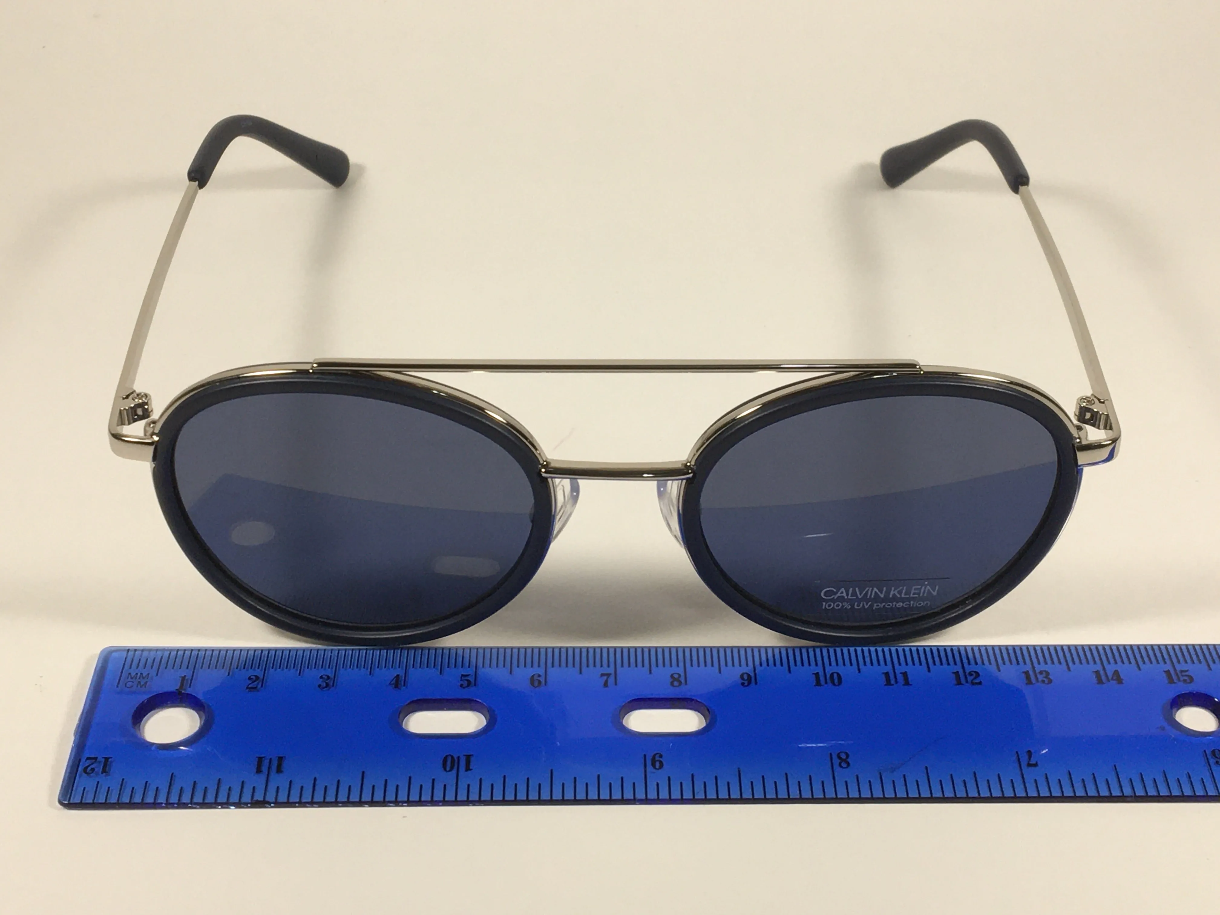 Calvin Klein CK19131S 410 Round Sunglasses Navy Blue And Silver Frame Gray Lens